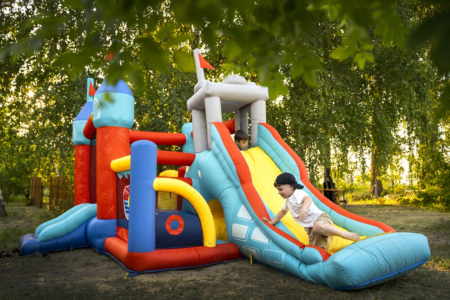 full-shot-kid-playing-bounce-house